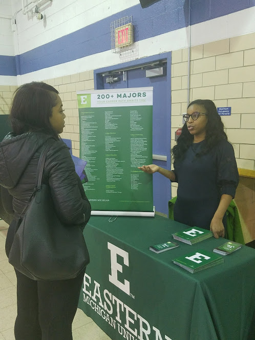 Eastern Michigan recruiter speaking with a student.