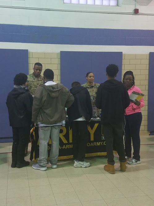 Army representatives speaking with students