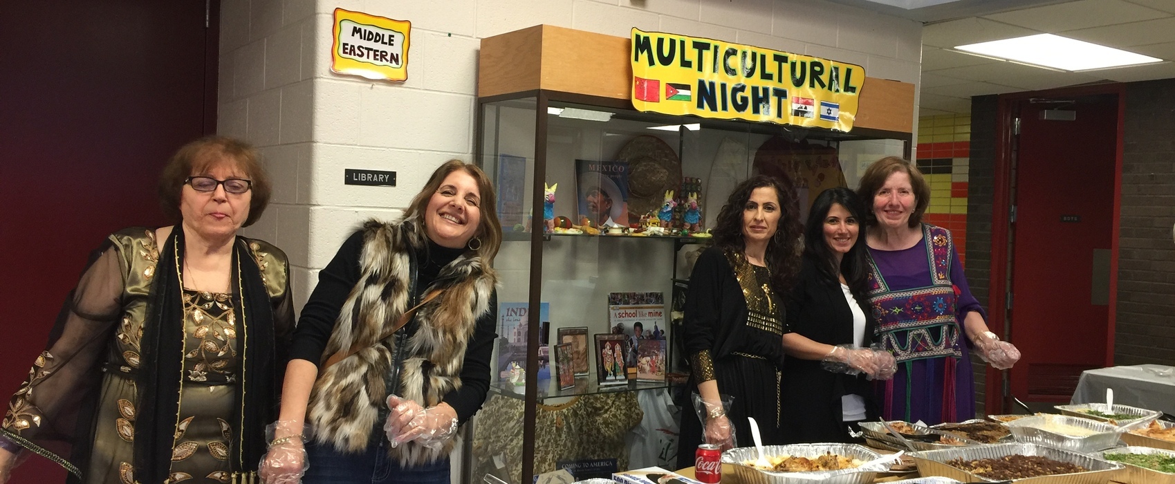 Parents, volunteers, and staff participate in Multicultural Night activities.