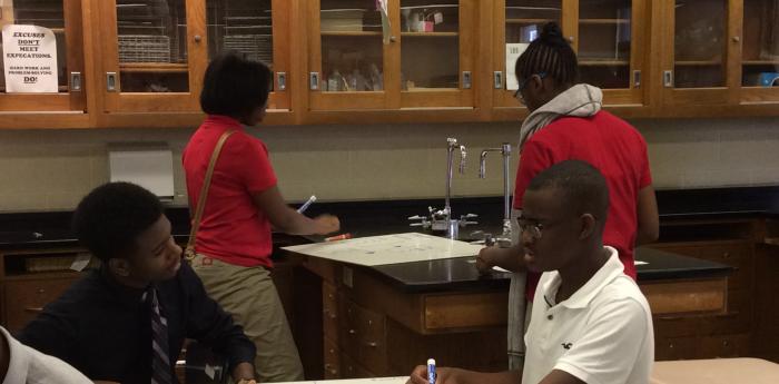 Chemistry students engaged in modelling in Ms. LaSovage's classroom.