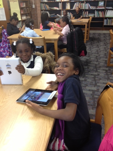 Using the iPads to learn makes everyone smile.