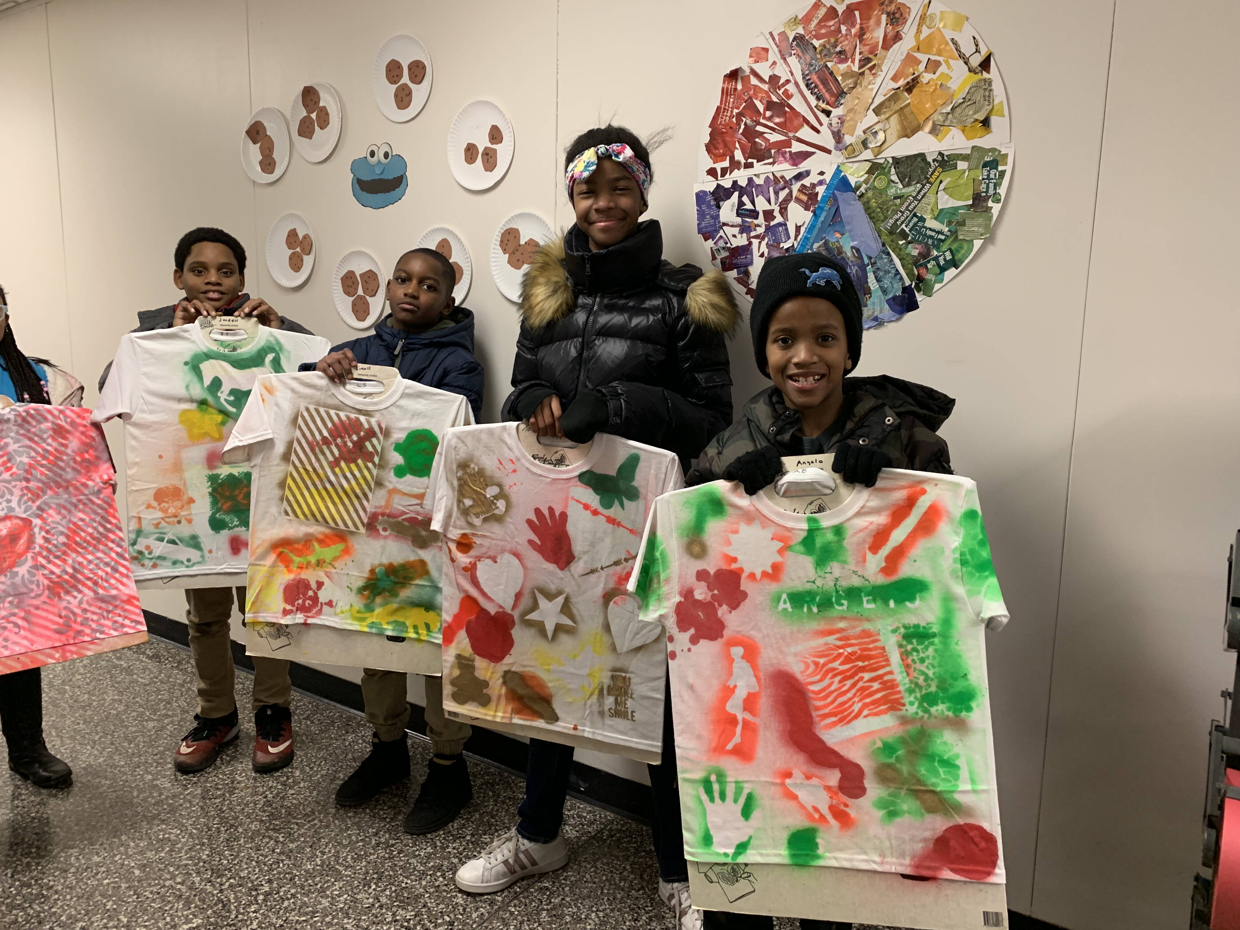 Group of students with their artwork
