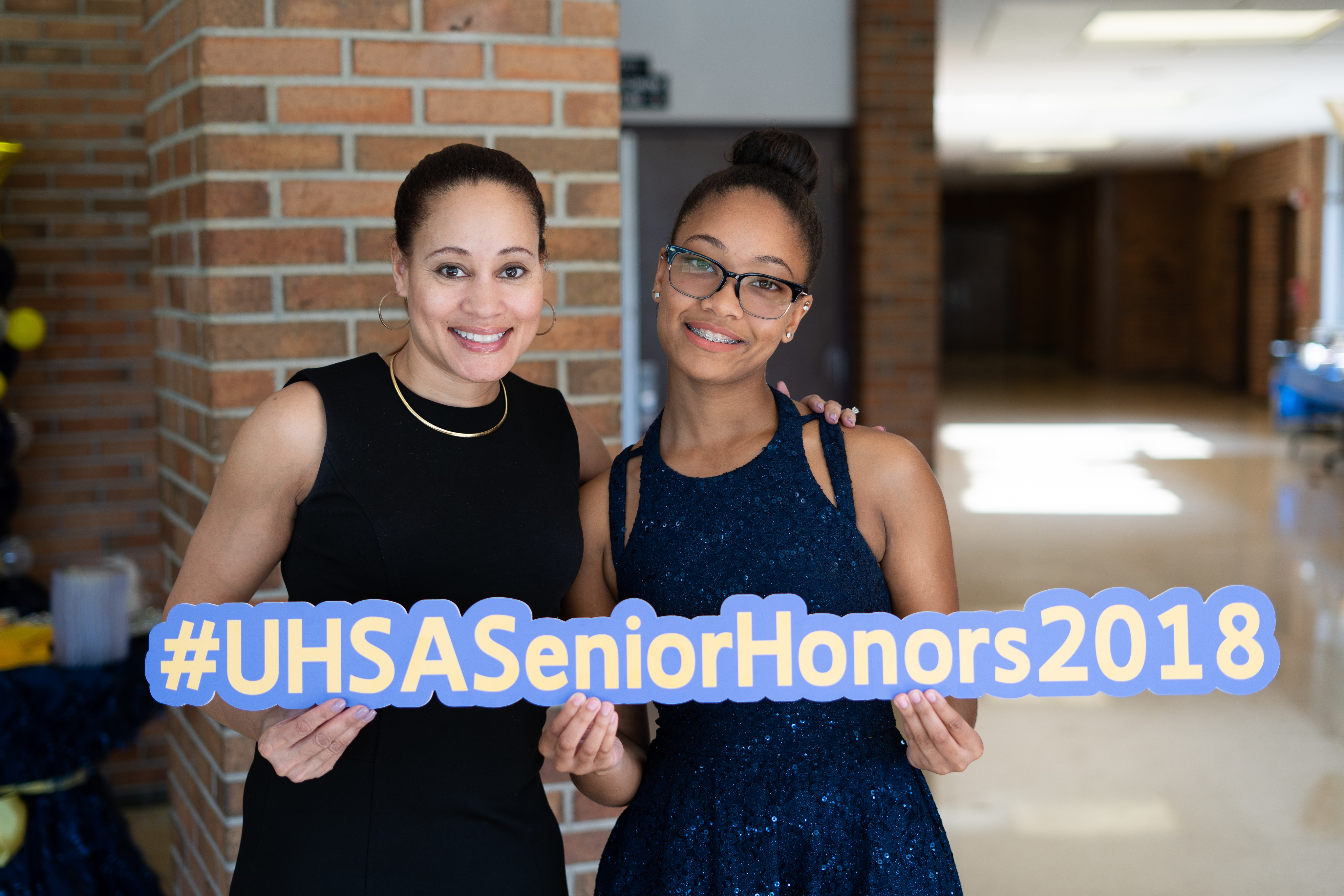 Two girls showing #UHSASeniorHonors2018